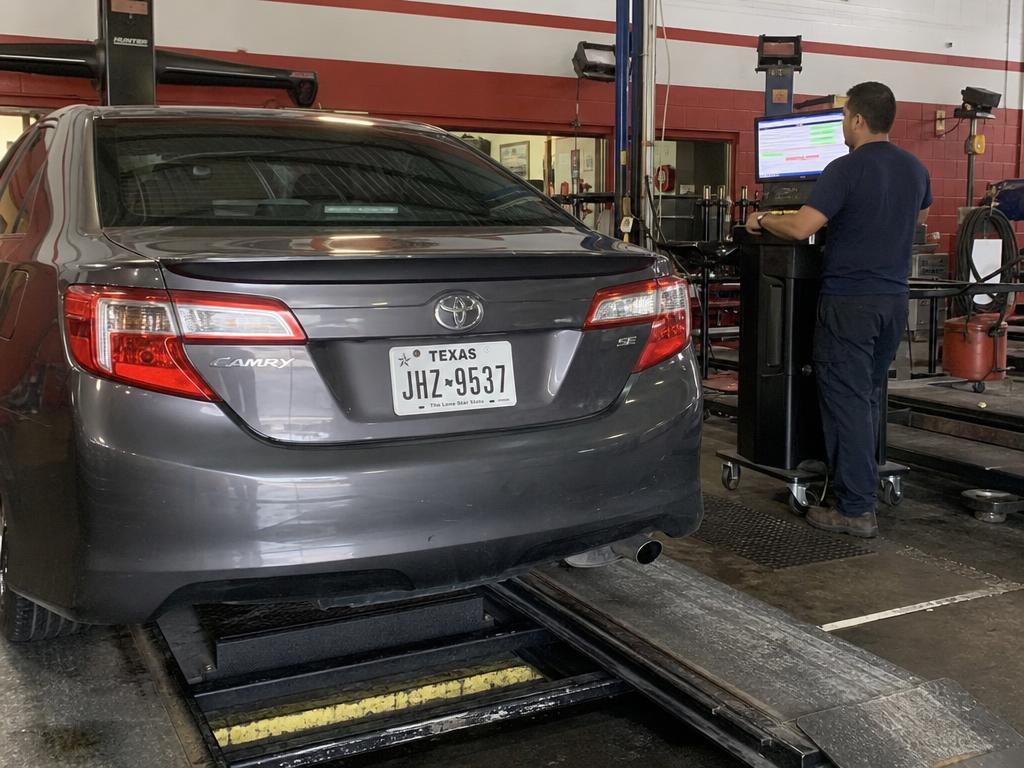 Toyota Camry computer diagnostics on a service lift